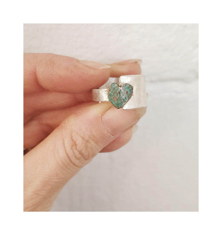 This Blue Heart Ring makes a statement with its bold copper heart shape and large Sterling Silver band.  Crafted from an artisan combination of silver, copper, this ring mimic long-lost artefacts from ancient civilisations with a unique textured finish.