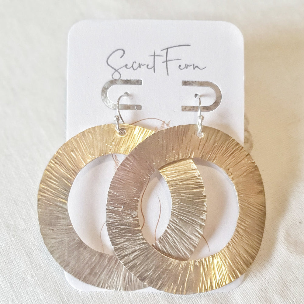 large earring hoops are made with Brass  measuring 7cm long and 5cm at tier widest point on sterling silver hooks. 