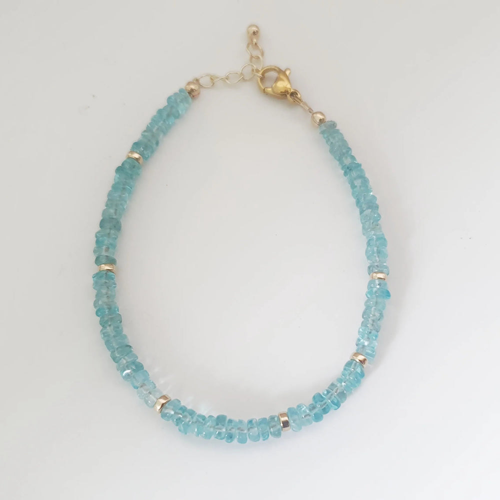Dive into the blue-green hues of Apatite, what an uplifting colour!  This bracelet is made of 4mm dainty Apatite gemstones with findings in 14k Gold Filled and Surgical Steel - perfect for sensitive skin.  Discreet yet sparkly, we love how elegant this bracelet is! It is also lightweight, so you can wear it anytime, anywhere.  Try mixing and matching it with our other gemstone bracelet styles to create a stacking effect. 