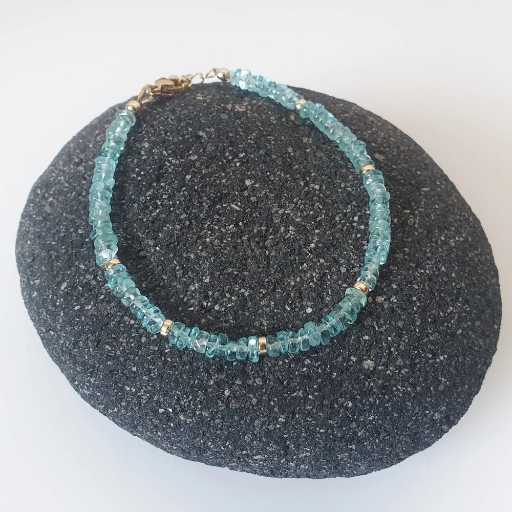 Dive into the blue-green hues of Apatite, what an uplifting colour!  This bracelet is made of 4mm dainty Apatite gemstones with findings in 14k Gold Filled and Surgical Steel - perfect for sensitive skin.  Discreet yet sparkly, we love how elegant this bracelet is! It is also lightweight, so you can wear it anytime, anywhere.  Try mixing and matching it with our other gemstone bracelet styles to create a stacking effect. 