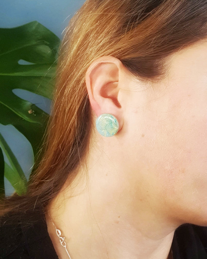 Designed & handmade in Waihi Beach with love.   A reminiscence of the colourful 1960s with these medium sized studs - 19.47mm circumference.    Studs are made with polymer clay, glazed and mounted on a hypoallergenic - surgical steel - setting.   They are lightweight and water resistant. Wear them anywhere, anytime. 