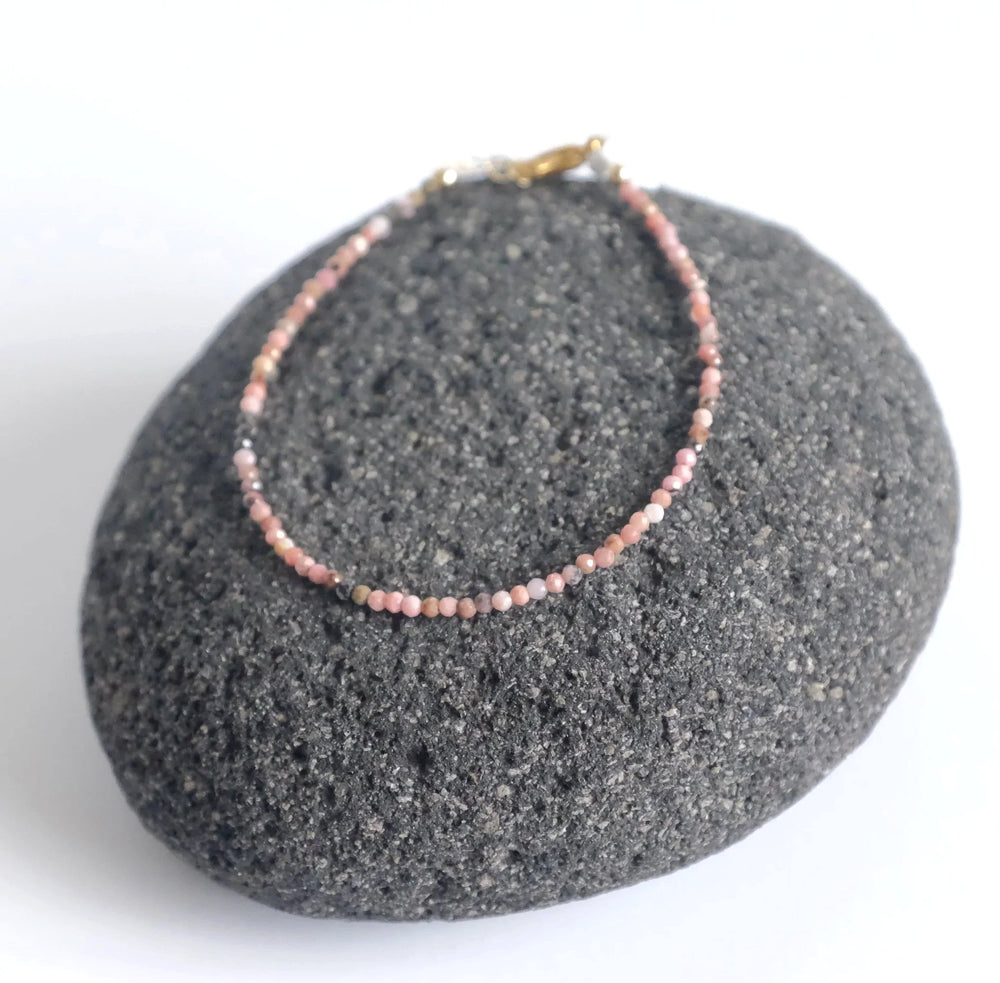 bracelet is made with micro natural pink Rhodonite gemstones and high quality hypoallergenic s. steel and 14K gold filled findings.