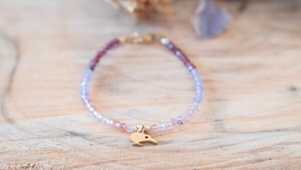 bracelet Made with a trio of tiny natural semi precious gemstones - Strawberry quartz, Amethyst and Rhodolite Garnet with our Secret Fern designed Kiwibird charm.