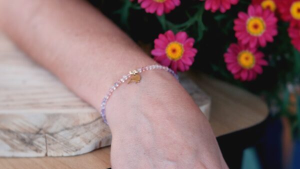 bracelet Made with a trio of tiny natural semi precious gemstones - Strawberry quartz, Amethyst and Rhodolite Garnet with our Secret Fern designed Kiwibird charm.