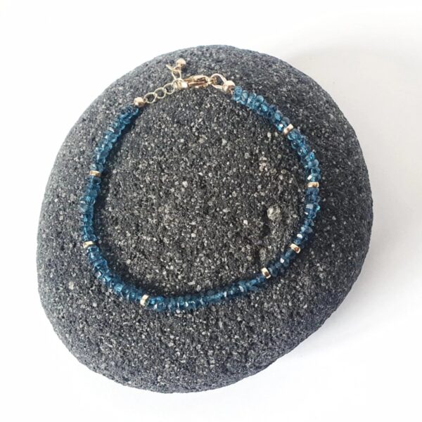 With its deep ocean blue and shimmering colour, the beauty of Topaz is captivating.   This bracelet is made of 4mm dainty Topaz gemstones with findings in 14k Gold Filled and Surgical Steel - perfect for sensitive skin.  Discreet yet sparkly, we love how elegant this bracelet is! It is also lightweight, so you can wear it anytime, anywhere.  Try mixing and matching it with our other gemstone bracelet styles to create a stacking effect.