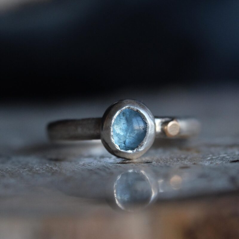 this one-of-a-kind ring features a pale blue moss aquamarine set in sterling silver, finished with a small 14k gold-filled dot as a gentle point of warmth