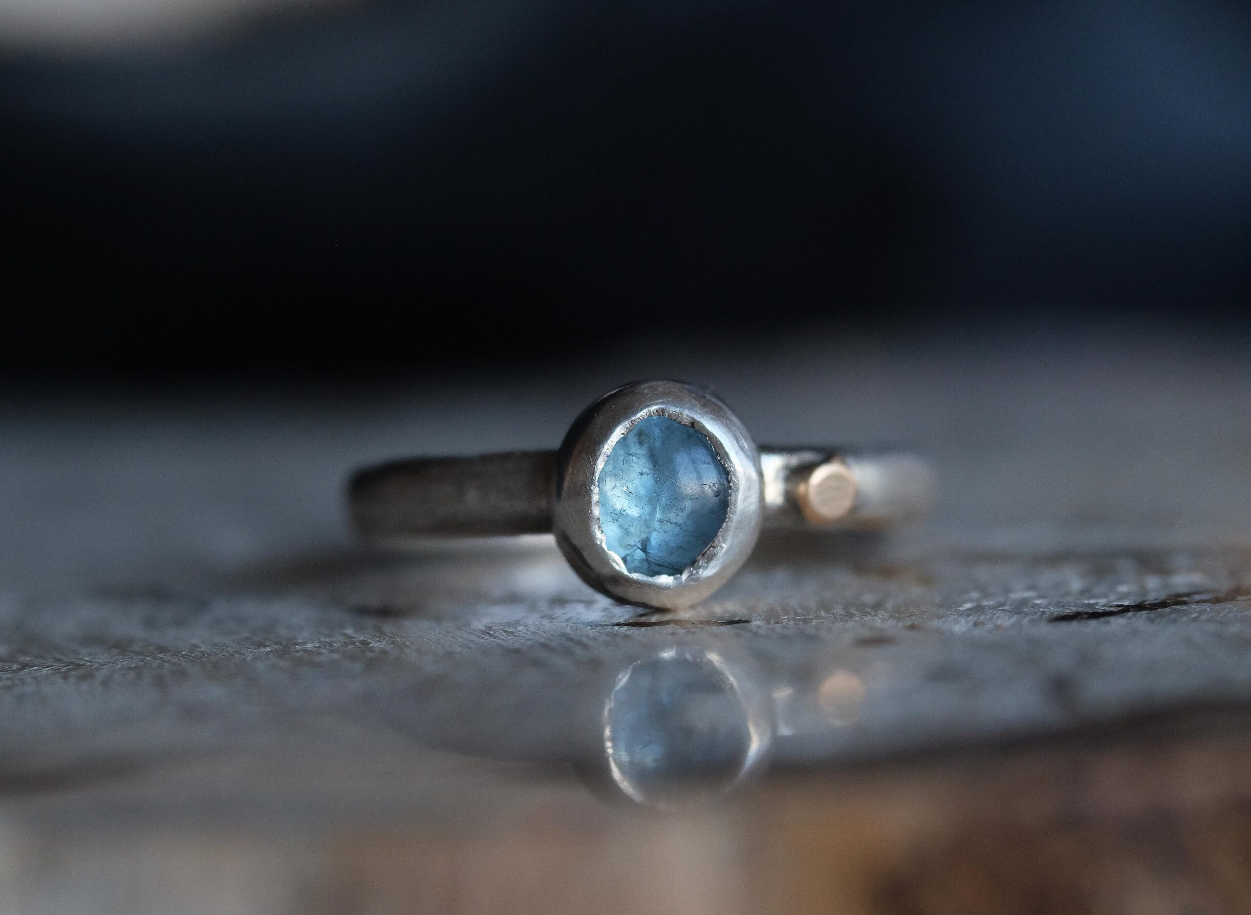 this one-of-a-kind ring features a pale blue moss aquamarine set in sterling silver, finished with a small 14k gold-filled dot as a gentle point of warmth