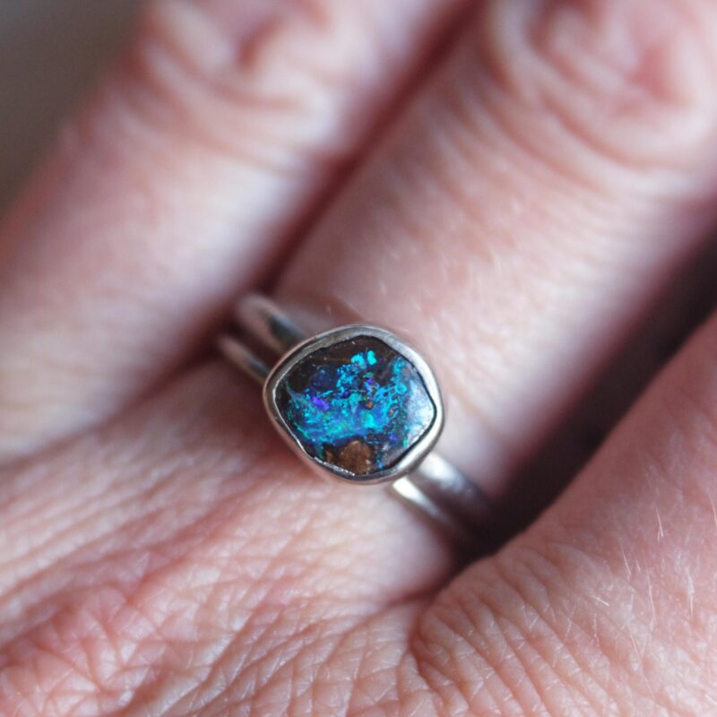 Koroit Opal Ring Handcrafted in my studio, this one-of-a-kind ring features an authentic Australian Koroit opal of 1.45 carats, set in solid sterling silver. This Queensland opal showcases a rich earthy matrix and electric blue and green flashes. This ring is an heirloom and a collector piece. 