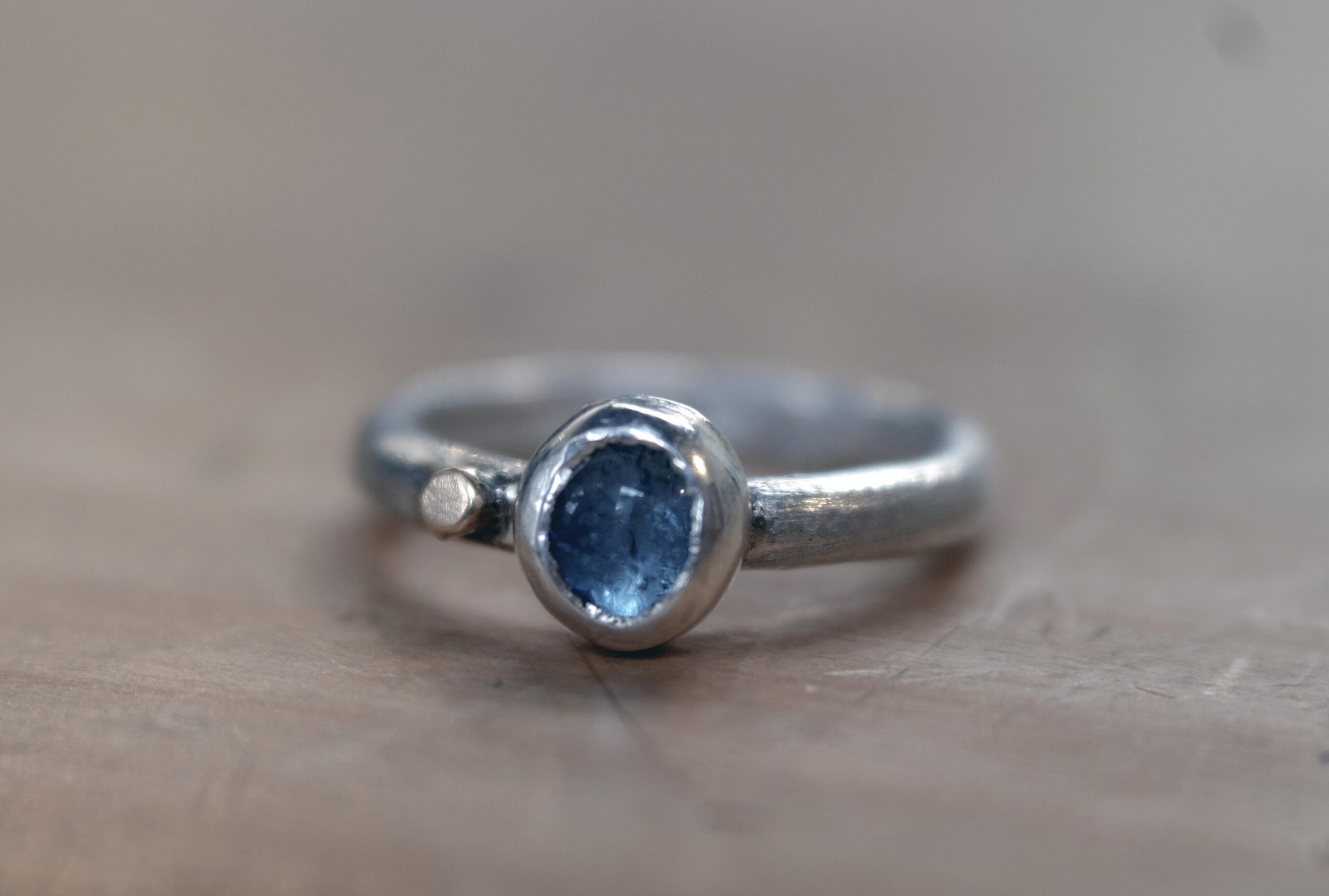 this one-of-a-kind ring features a pale blue moss aquamarine set in sterling silver, finished with a small 14k gold-filled dot as a gentle point of warmth
