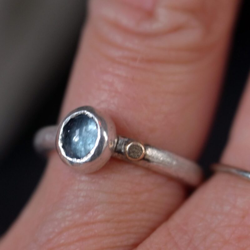 this one-of-a-kind ring features a pale blue moss aquamarine set in sterling silver, finished with a small 14k gold-filled dot as a gentle point of warmth